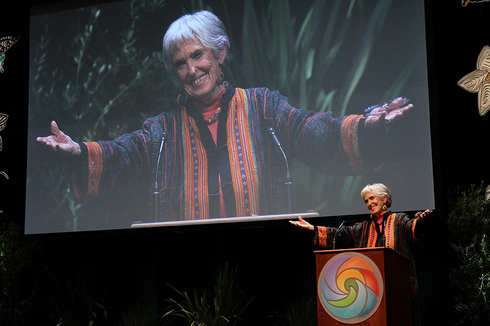 a woman speaking at a podium