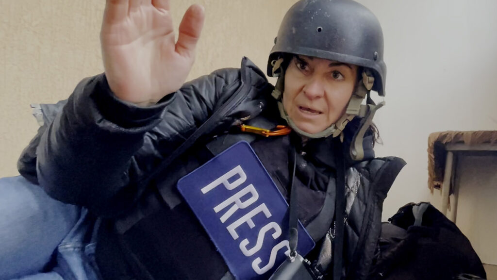 ‘Free Solo’ Helmers’ Doc on Photog Lynsey Addario Lynsey Addario finds shelter from a nearby shelling during an assignment in Ukraine in Love + War
