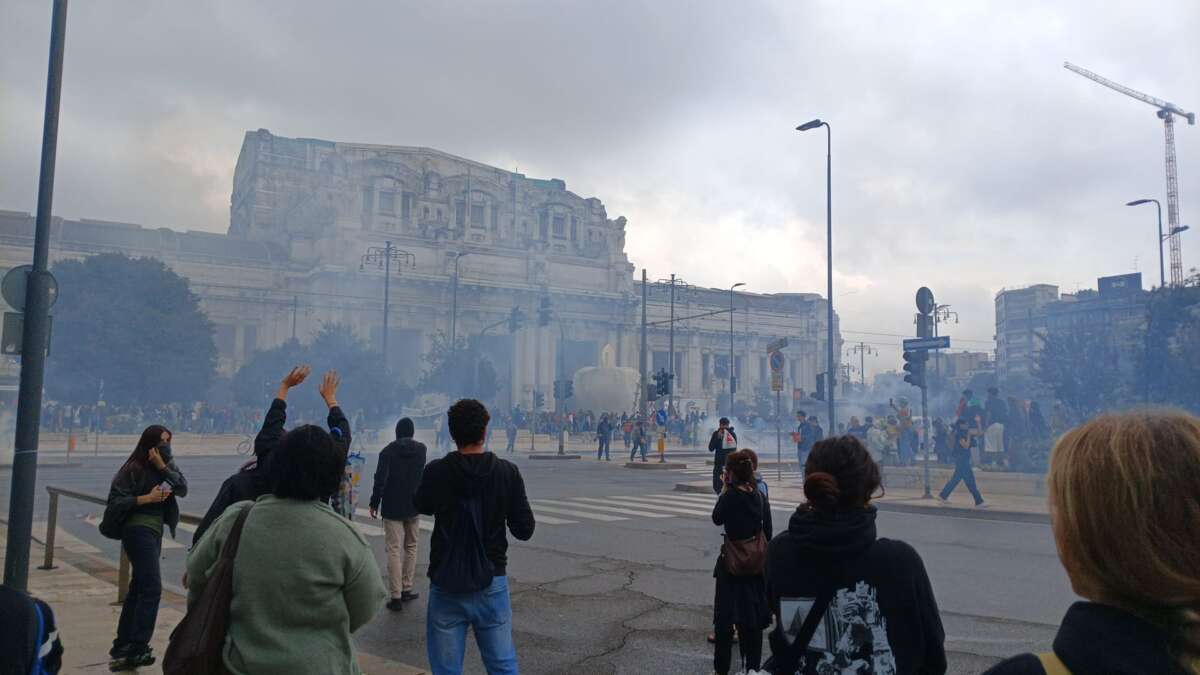 Protesters stand outside Milan’s central station on September 22, 2025.
