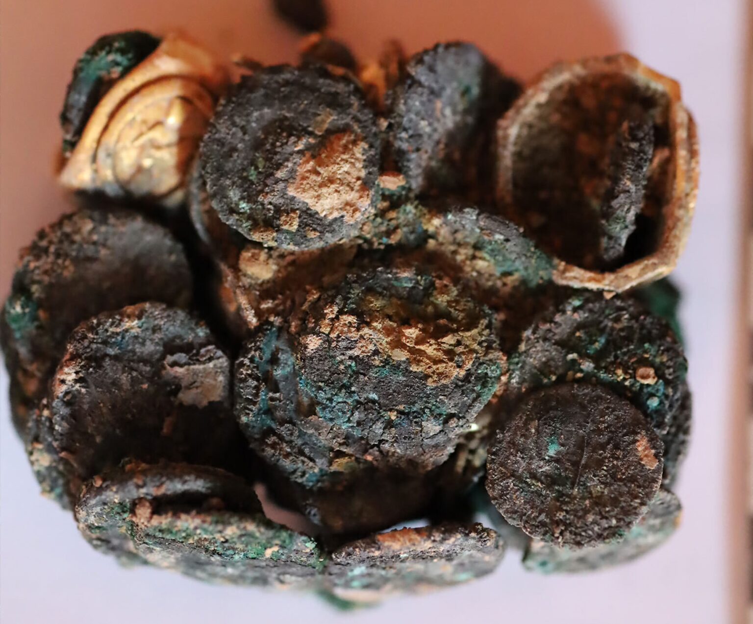 a clump of burnt and charred coins