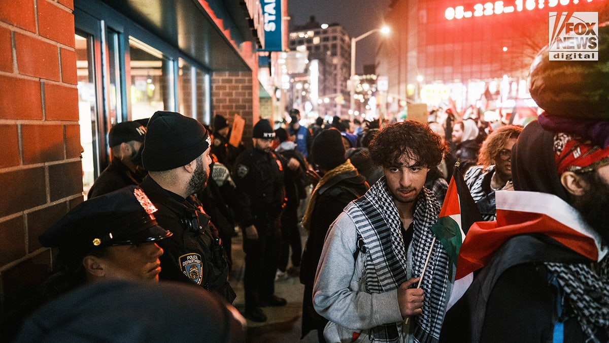 Pro-Palestine protestors make their way through Manhattan after marching across the Brooklyn Bridge