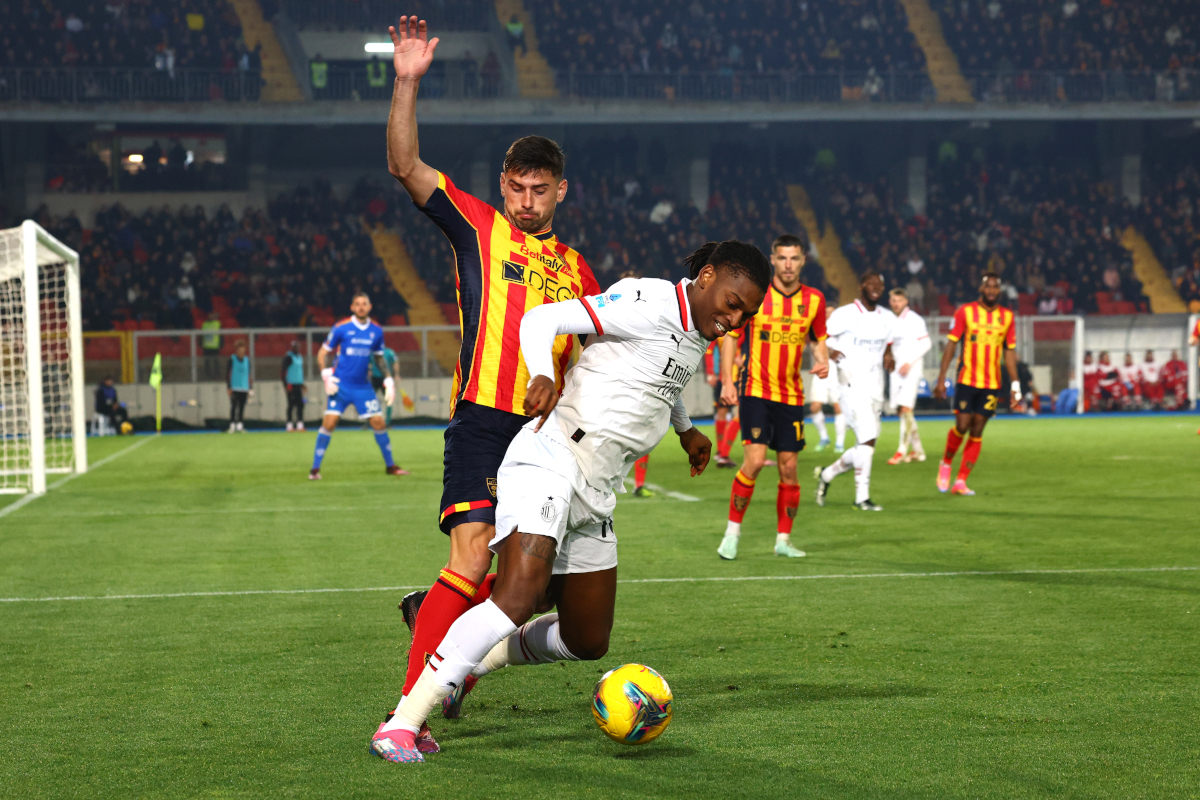 LECCE, ITALY - MARCH 08: Santiago Pierotti of Lecce competes for the ball with Rafael Leao of Milan during the Serie A match between Lecce and AC Milan at Stadio Via del Mare on March 08, 2025 in Lecce, Italy. (Photo by Maurizio Lagana/Getty Images)