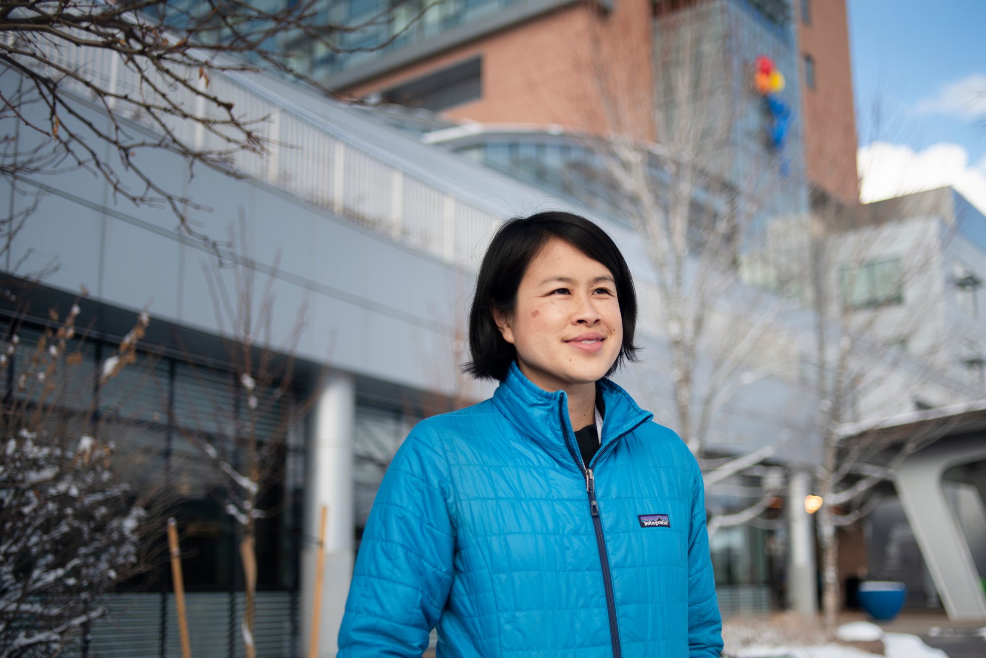Dr. K. Ron-Li Liaw, mental health in chief at Children's Hospital, wears a blue jacket as she stands outside the hospital