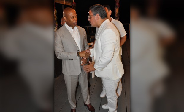Mayor Eric Adams, left, at a July 2024 "White Party" with James Caban, the brother of ex-Police Commissioner Edward Caban. (Obtained by Daily News) 