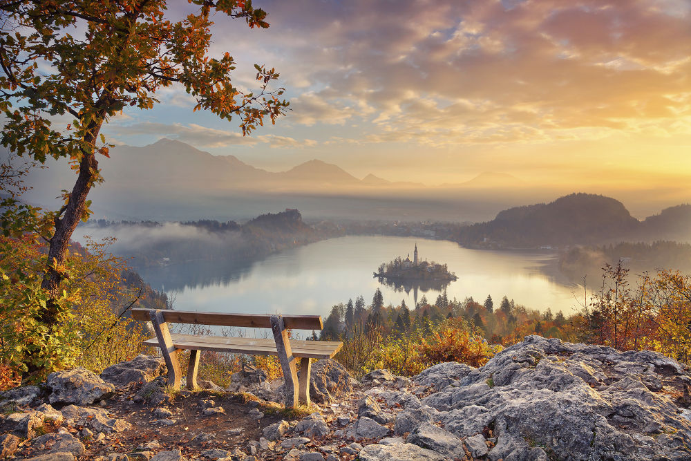 Lake Bled with small Bled Island during autumn sunrise. Bled, Slovenia, Europe.