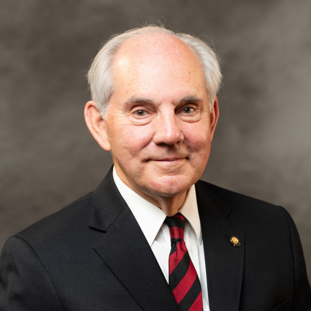 A headshot of Charles Faulkner