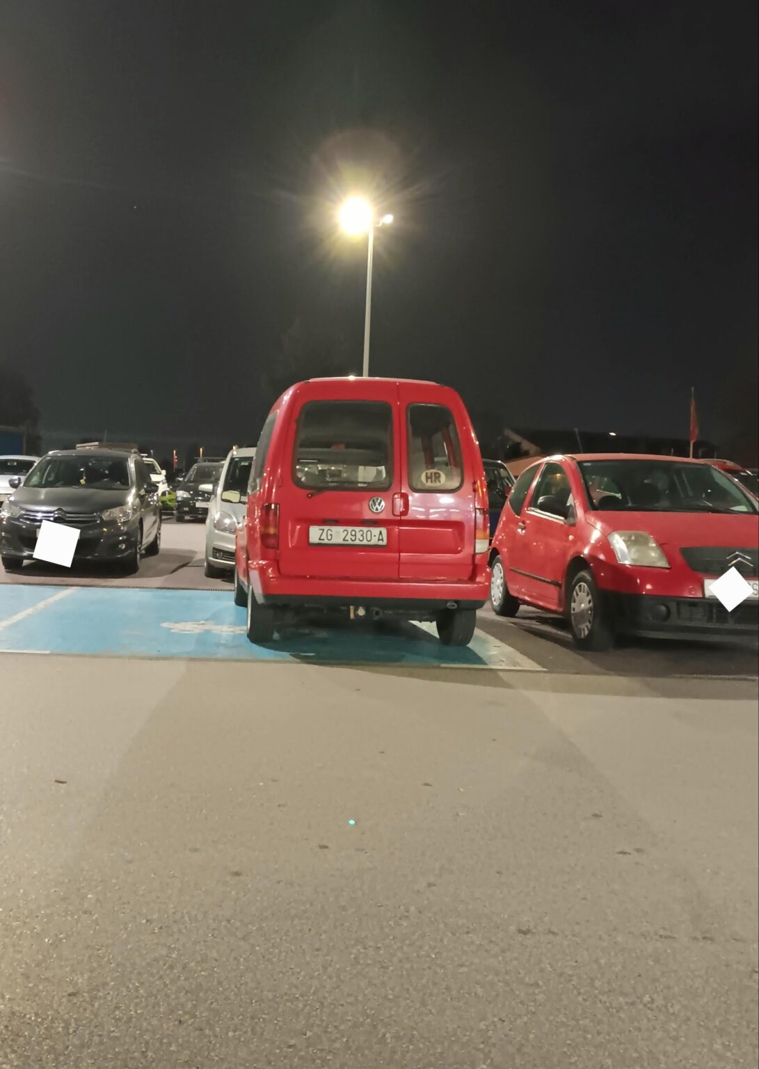 Blue parking spaces in front of supermarkets
