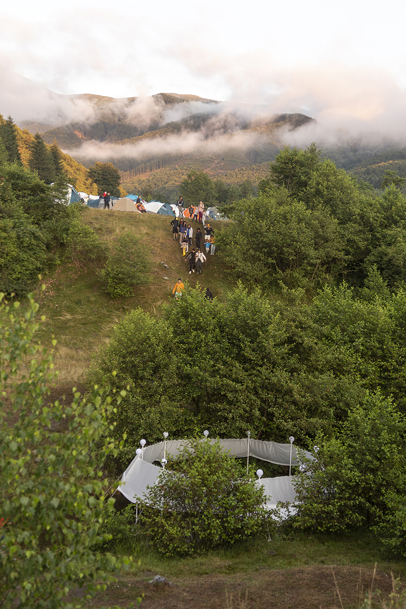 ephemeral circle textile installation by atelier VRAC activates mountain river in romania