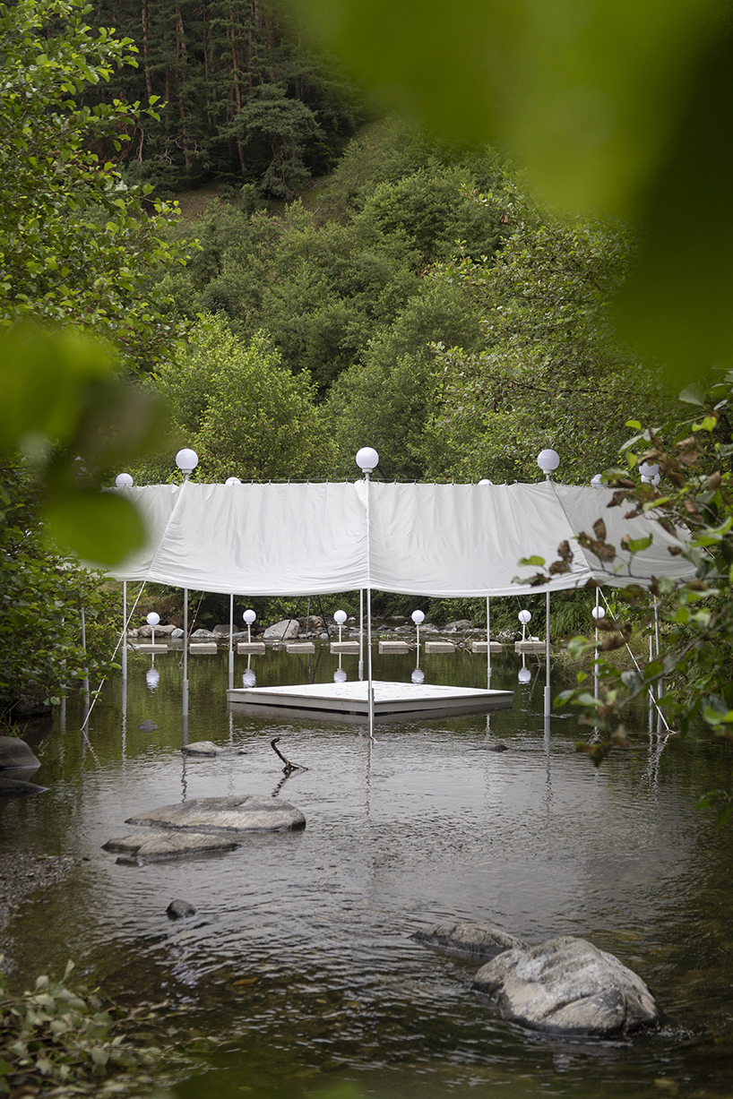 ephemeral circle textile installation by atelier VRAC activates mountain river in romania