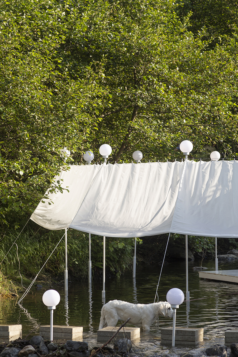 ephemeral circle textile installation by atelier VRAC activates mountain river in romania
