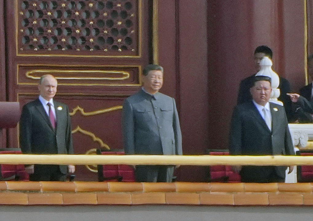 Russian President Vladimir Putin, Chinese President Xi Jinping and North Korean leader Kim Jong-un attend a large-scale military parade marking the 80th anniversary of Victory Day at Tiananmen Square in Beijing on Sept. 3. [KYODO/YONHAP]