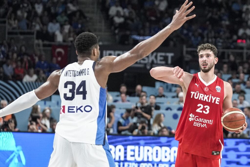 Alperen Sengun of Türkiye, goes up against Giannis Antetokounmpo of Greece during the FIBA EuroBasket 2025 semifinal at Riga Arena in Riga, Latvia, September 12, 2025. (AA Photo)