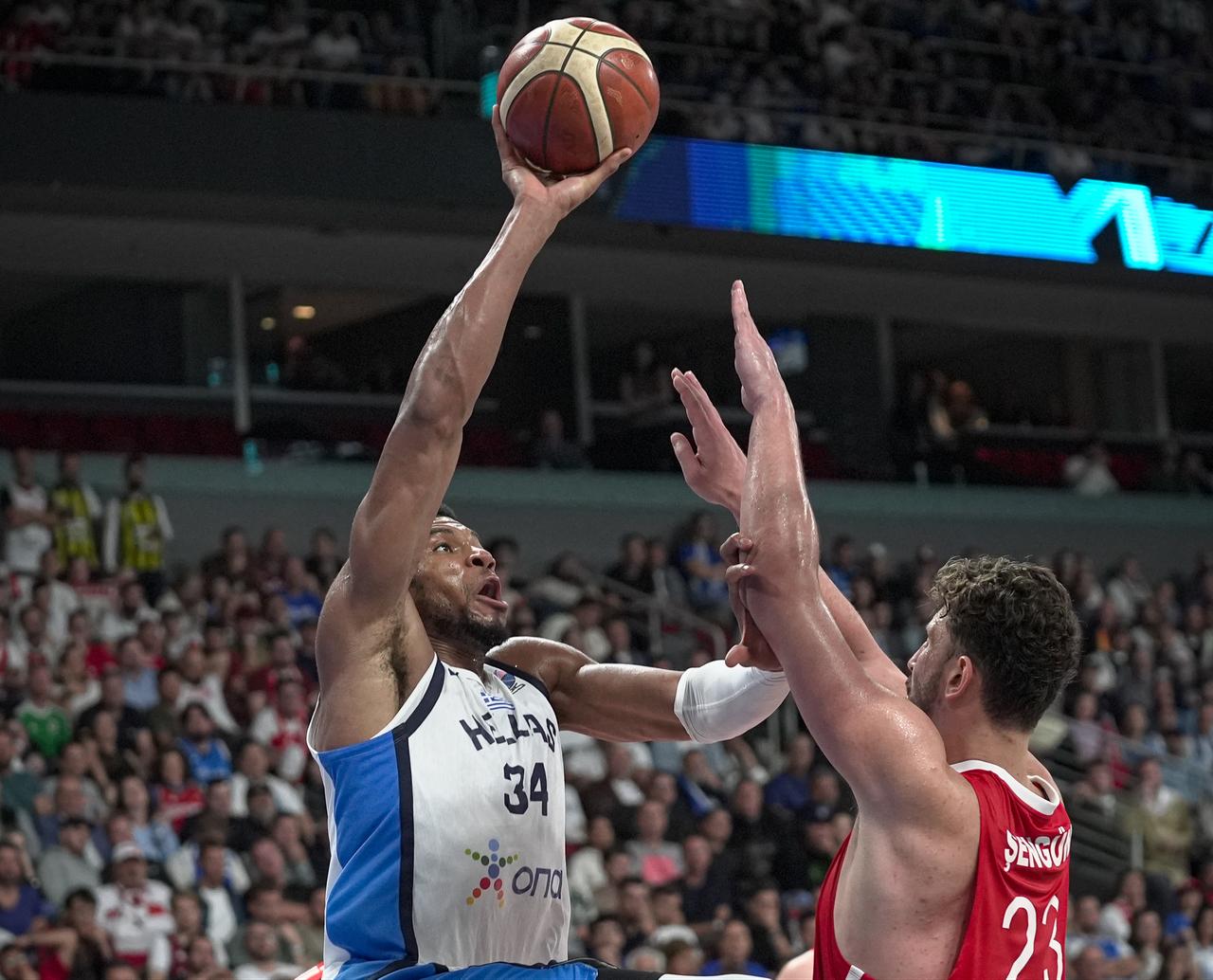 Alperen Sengun of Türkiye, faces off against Giannis Antetokounmpo of Greece in the FIBA EuroBasket 2025 semifinal at Riga Arena, Riga, Latvia, September 12, 2025. (AA Photo)