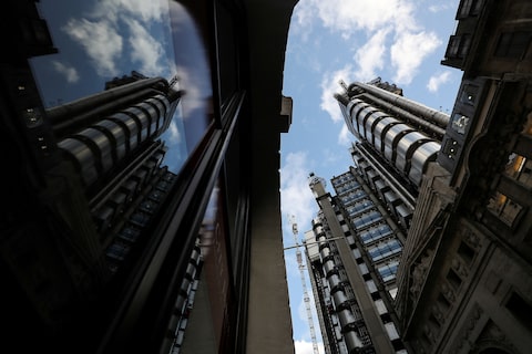 The Lloyd's of London building is reflected in a window in the City of London financial district in London, Britain, February 1, 2018. REUTERS/Simon Dawson/File Photo