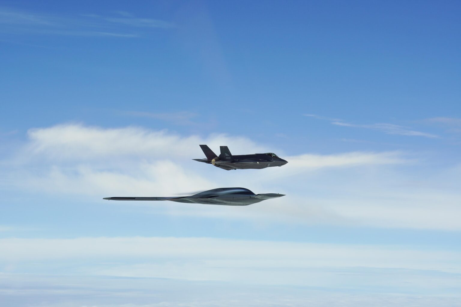 A B-2A Spirit strategic bomber in formation with a RNoAF F-35A Lightning IIs over the Norwegian Sea, September 3.