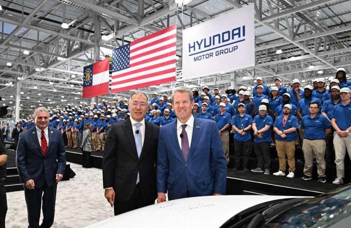 Hyundai Motor Chairman Chung Euisun (left) and Georgia Gov. Brian Kemp pose for a photo during the opening ceremony of Hyundai Motor Group Metaplant America (HMGMA) in Ellabell, Georgia, on March 26, 2025