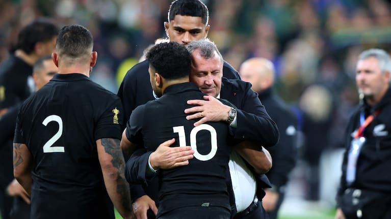 Richie Mo'unga hugs coach Ian Foster after the 2023 World Cup final defeat to South Africa.