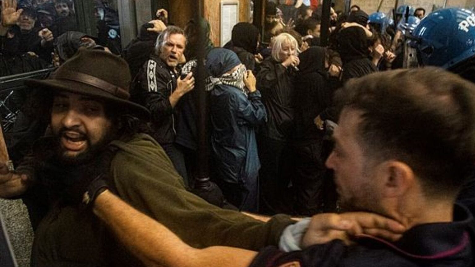 Protesters enter Central Station during clashes with police after the strike march in support of Palestine, in Milan, Italy