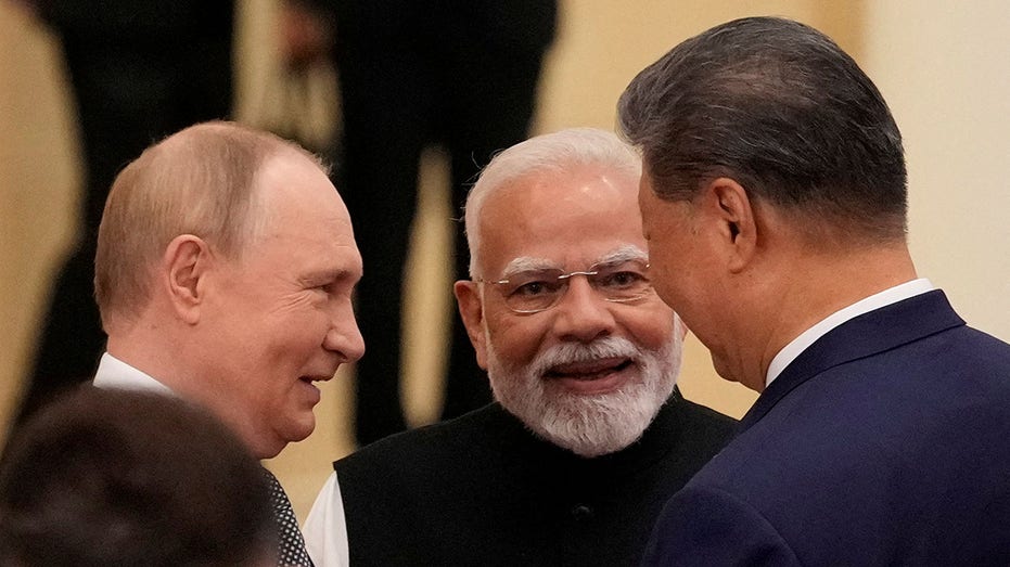 Vladimir Putin, Narendra Modi and Xi Jinping talk