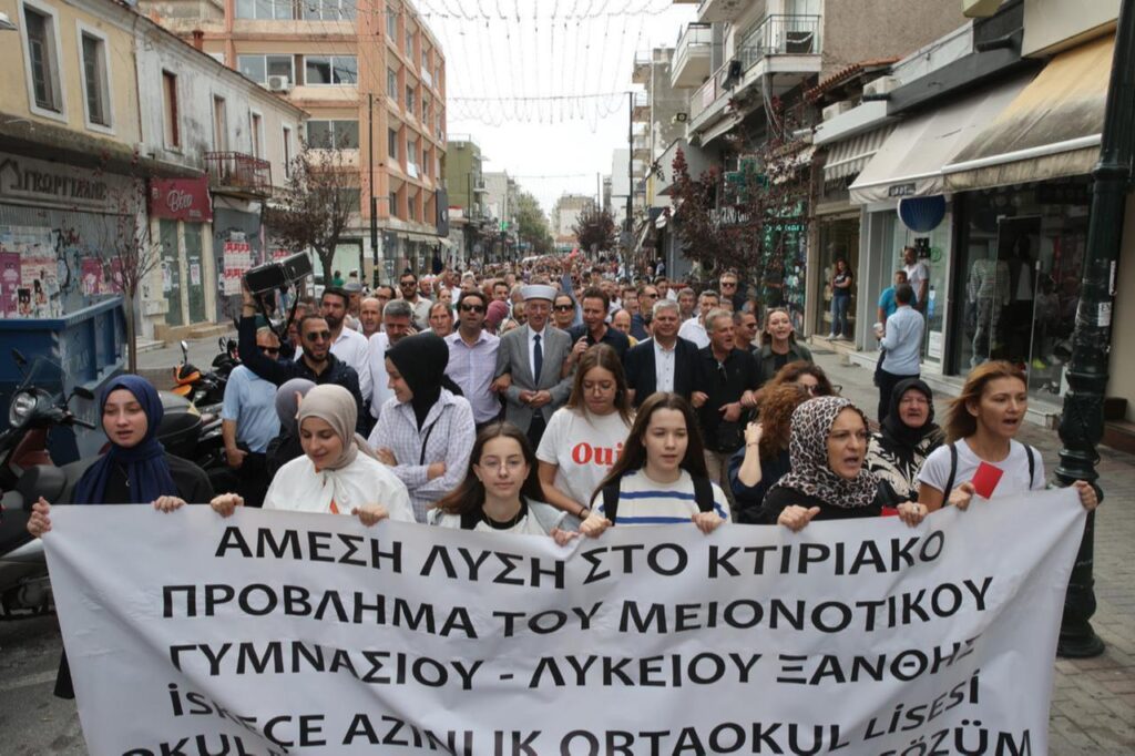 Turks from Western Thrace hold  red cards  and banners in Xanthi, Greece, September 25, 2023. (AA Photo)