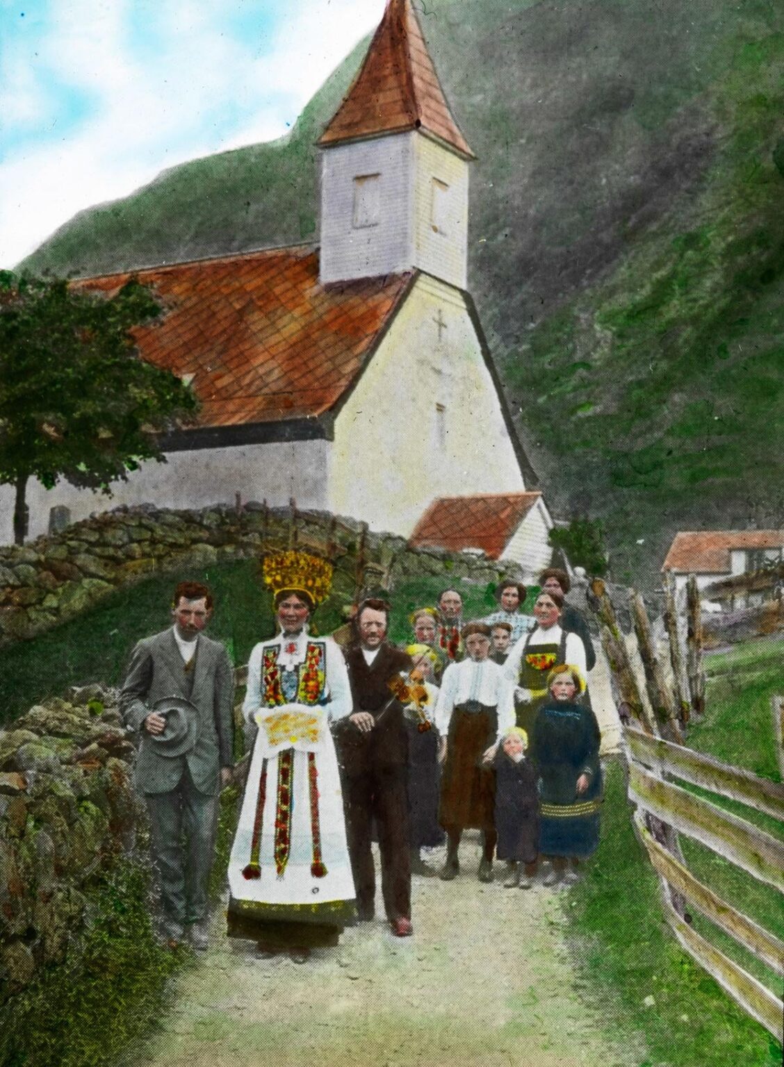 Wedding procession in Eidfjord church. Norway, 1900. Hand-colorized.