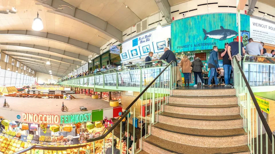 Frankfurt, Germany - March 16, 2024: people enjoy shopping in the Kleinmarkthalle in Frankfurt, Germany. The hall from 1954 is the most famous fresh food market in Frankfurt on 1500 SQM.