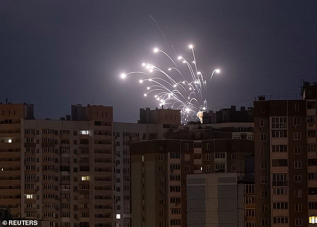 Pictured: Explosions light up the sky during Russian drone and missile strikes