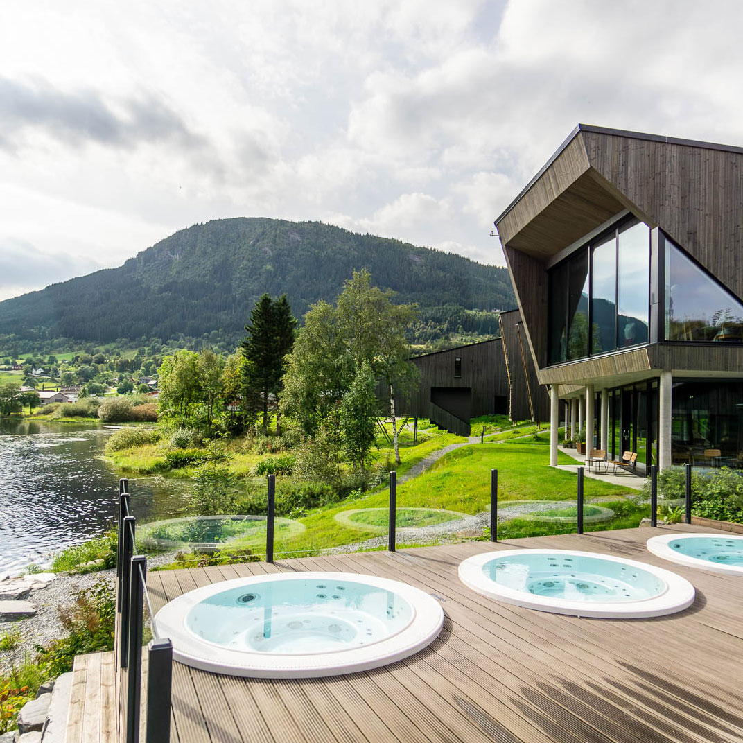 Bedrooms at the One-Key Elva Hotel in Skulestadmo, Norway, occupy five mini houses that blend effortlessly into the landscape  (© Elva Hotel)