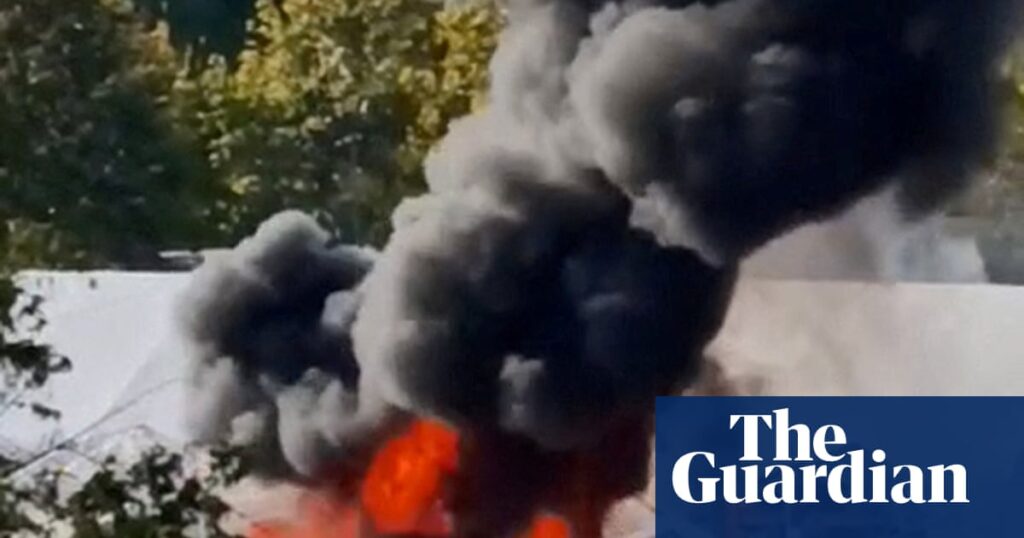 Protesters' tents on fire after shots reportedly fired outside Serbian parliament – video | Serbia