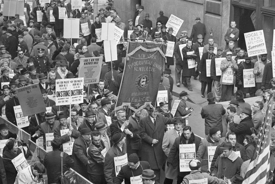 Striking Typesetters March with Banner