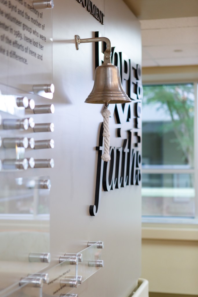 A bell hangs on a wall at the cancer center