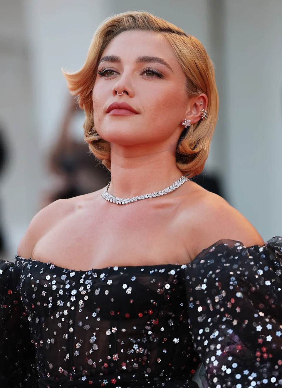 Florence Pugh in a sparkling, strapless black gown at the 79th Venice International Film Festival