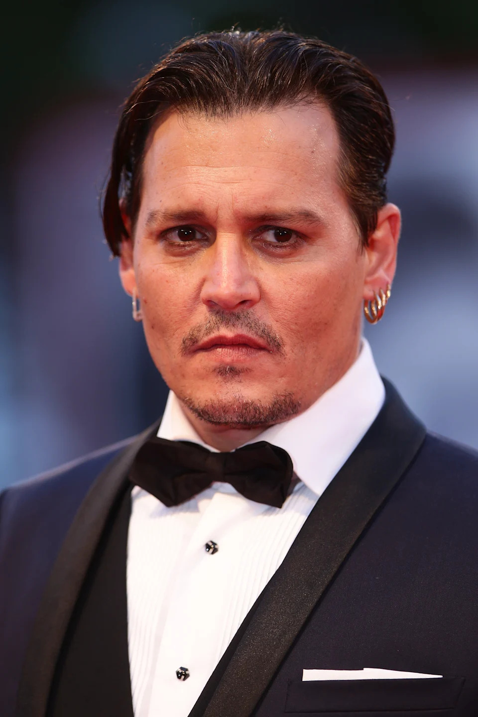 Johnny Depp is wearing a bow tie at the 72nd Venice Film Festival