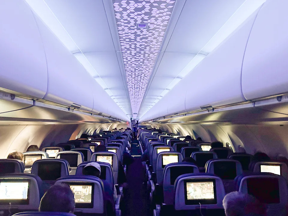 A wide view of an airplane cabin at night