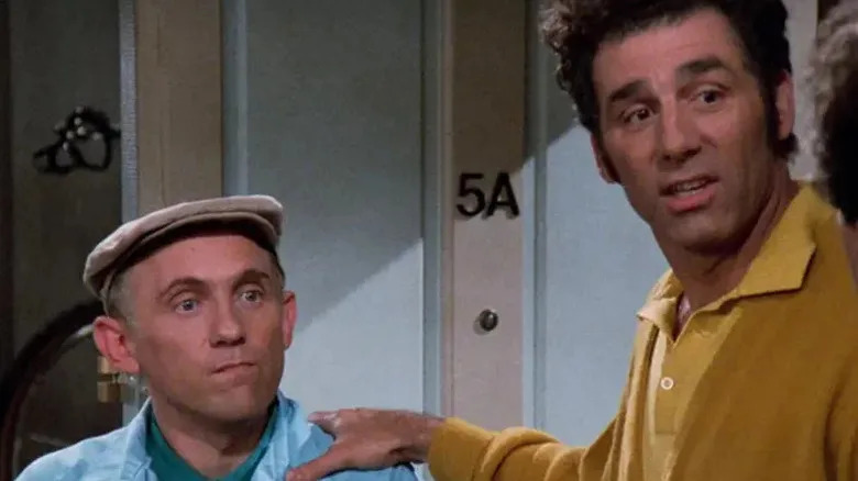 Kramer with his hand on Stan's shoulder on Seinfeld