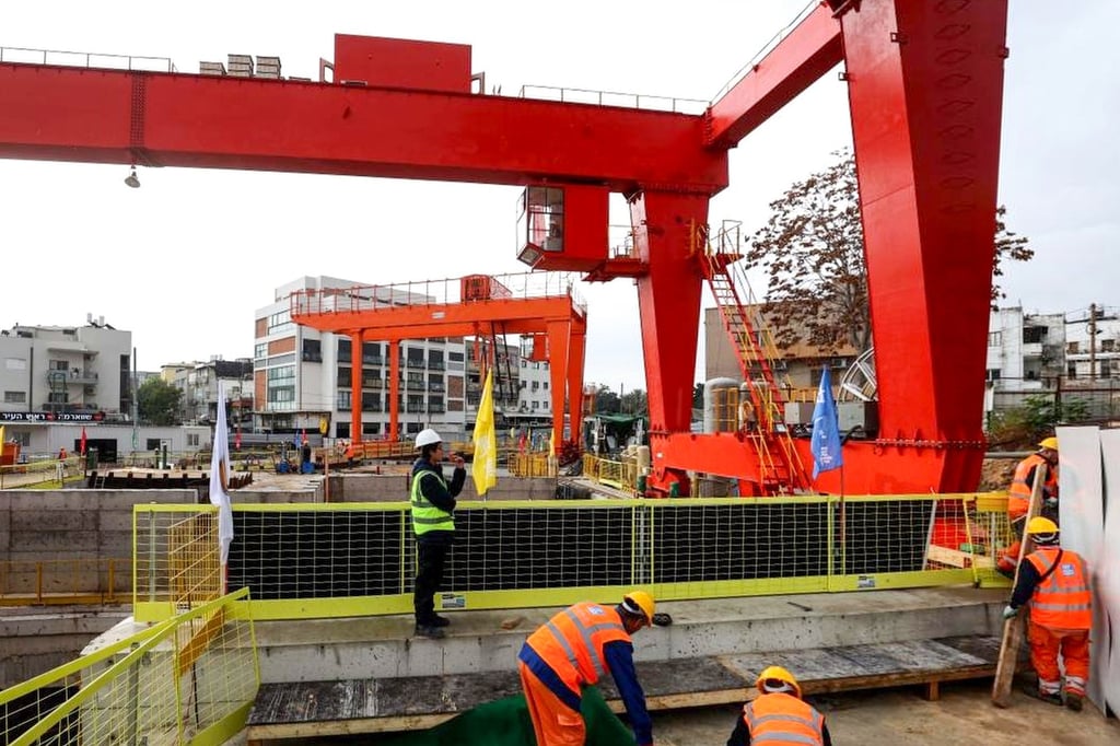 Construction workers at a section of the Tel Aviv light rail Green Line. Photo: Xinhua Construction workers at a section of the Tel Aviv light rail Green Line. Photo: Xinhua