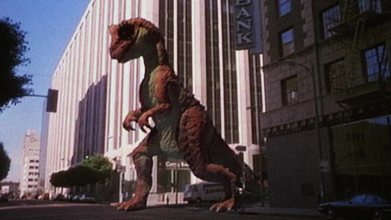 A dinosaur walking down the street in a fake TV commercial in RoboCop