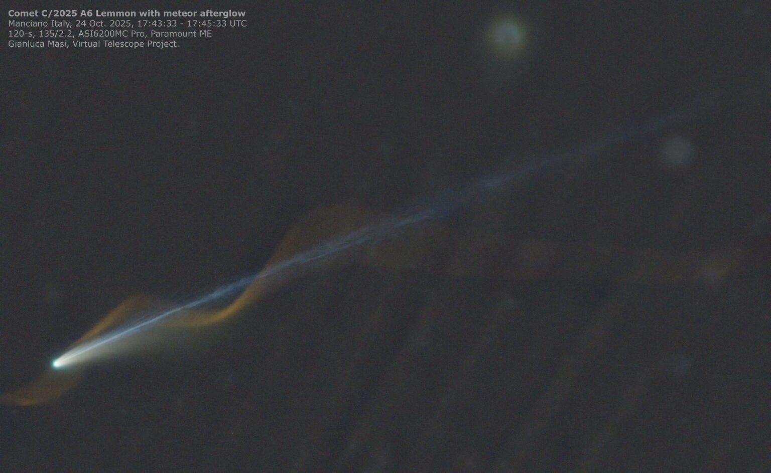 Once in a lifetime photo of comet Lemmon with meteor red afterglow creating wavy line. By Virtual Telescope Project