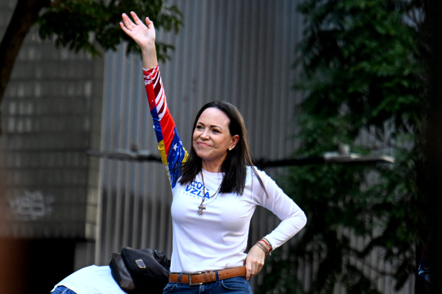 Venezuelan opposition leader Maria Corina Machado waves.