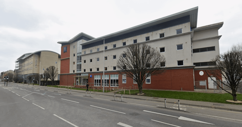 Old hotel full of city's homeless has residents terrified of leaving their homes