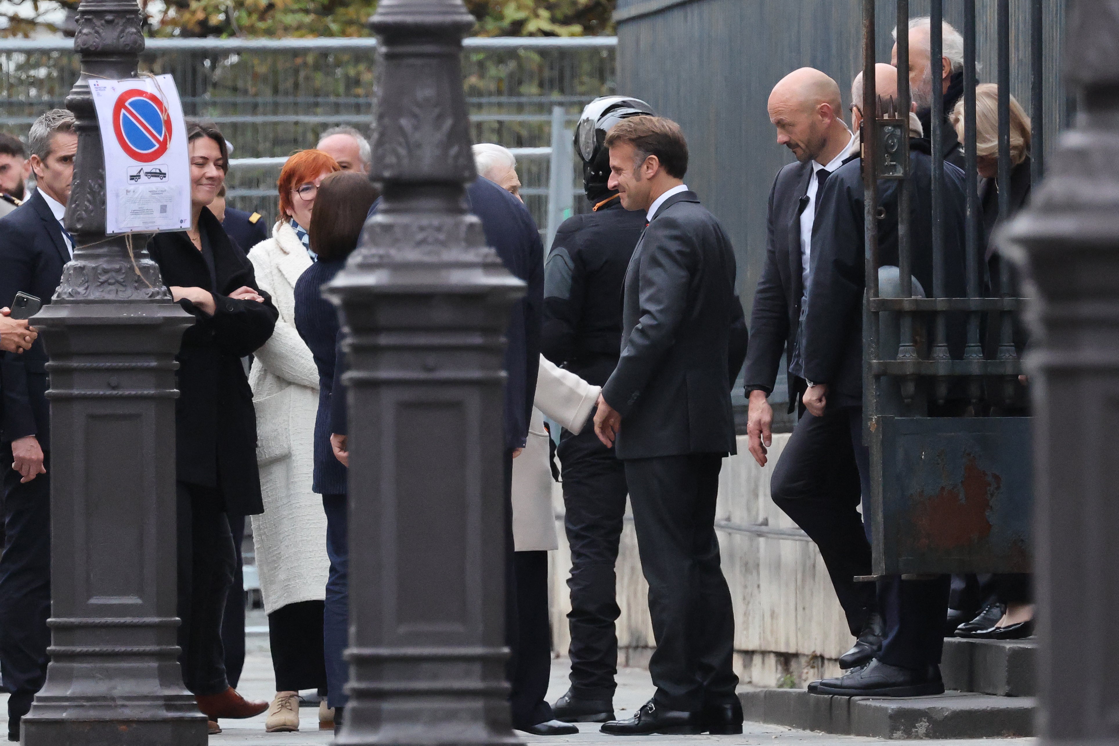 Emmanuel Macron (C) leaves the Pantheon in Paris hours after Lecornu’s resignation was announced