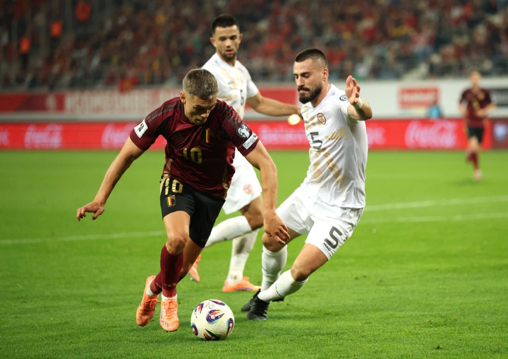 Leandro Trossard of Belgium is challenged by Gjoko Zajkov of North Macedonia during the FIFA World Cup 2026 Qualifier match between Belgium and North Macedonia.