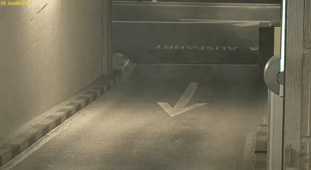 Driver (with Bern plates?) runs out of control at the parking lot exit