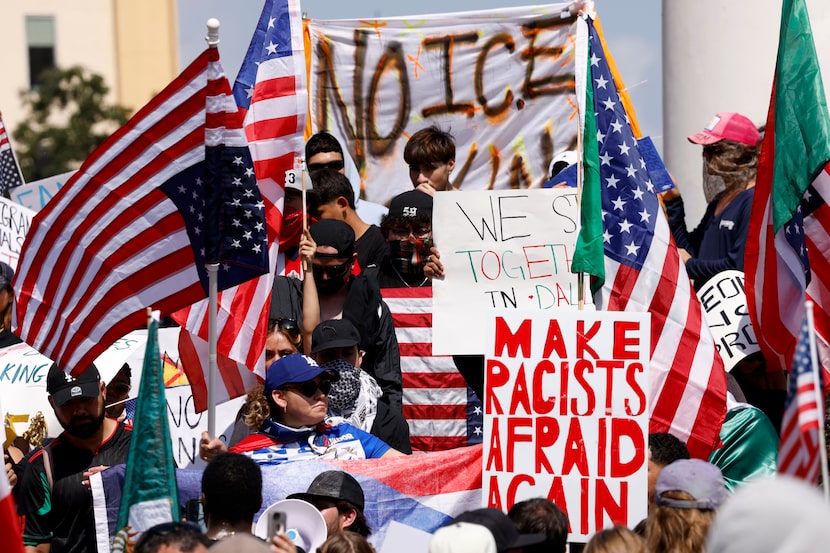 Demonstrators rally outside Dallas City Hall during a ‘No Kings’ protest against policies of...