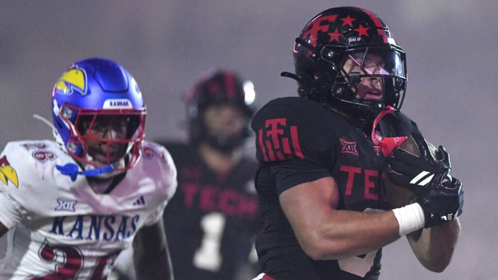 Texas Tech running back Cameron Dickey (8) runs into the end zone for a touchdown during the fourth quarter of an NCAA college football game, Saturday, Oct. 11, 2025, in Lubbock, Texas. (AP Photo/Annie Rice)