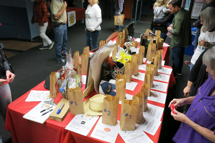 A table full of raffle items at Turkey Bowl