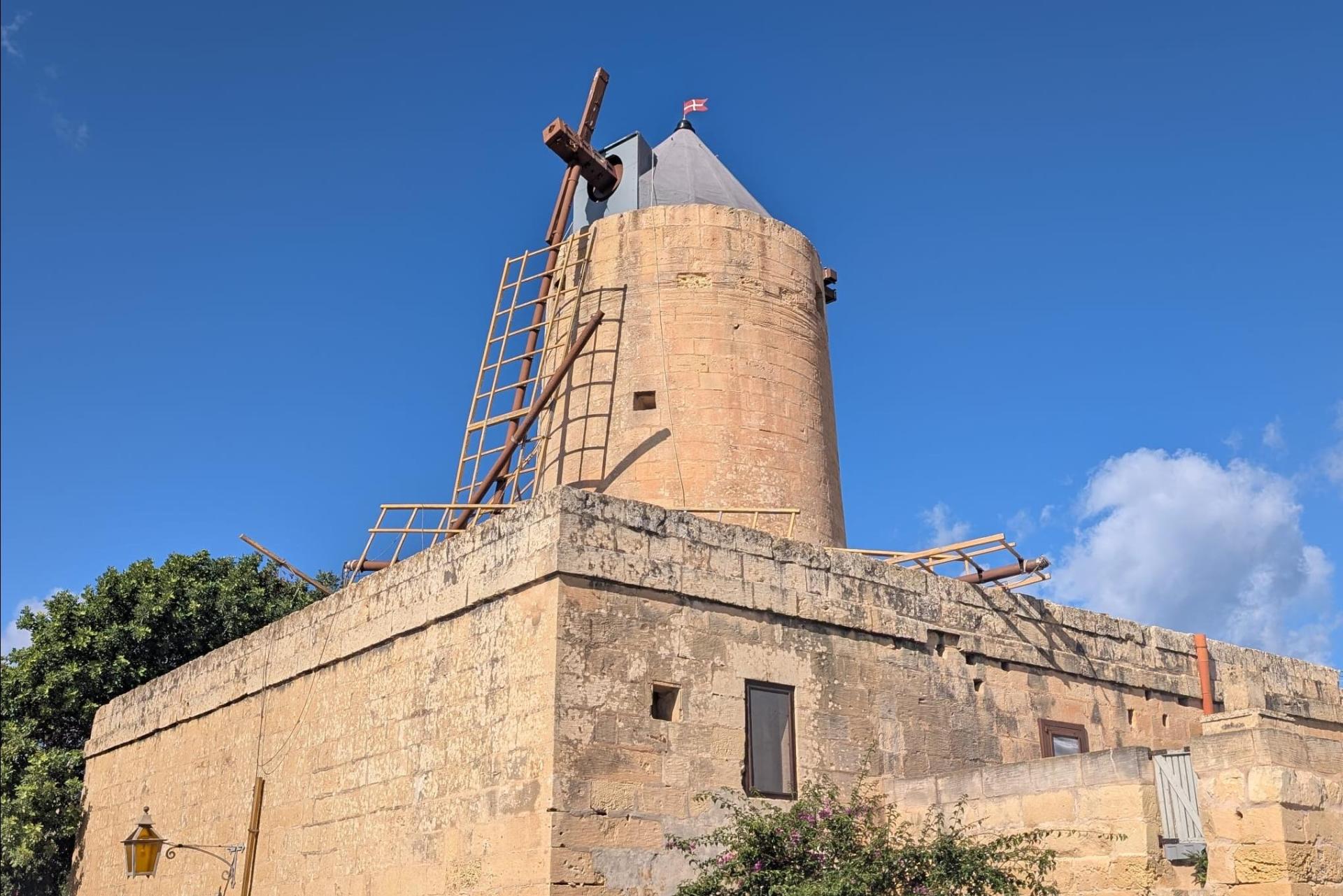Workers were manually turning the sails when they fell.
