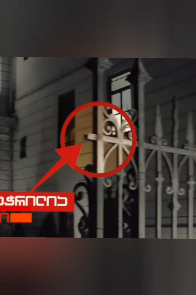 The fence around the presidential palace had already been cut and was only held together with wire by the time protesters began pulling it down