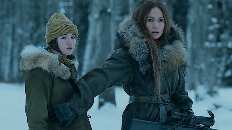 The Mother holds back Zoe in The Mother (2023)