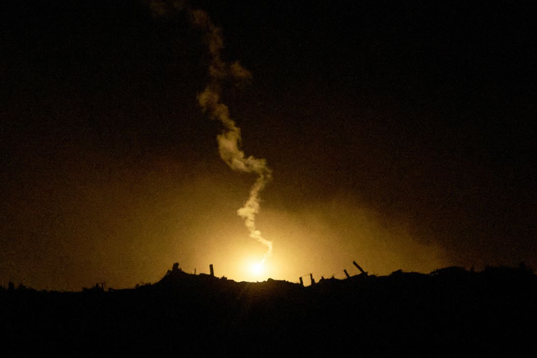 An Israeli army flare drifts over an area in the northern Gaza Strip, as seen from southern Israel, on Tuesday.